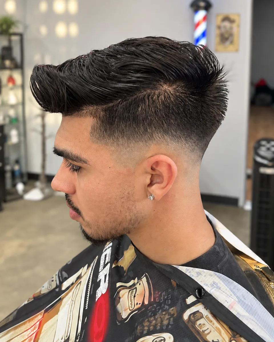 Side view of a clean taper fade with a defined edge-up along the temple