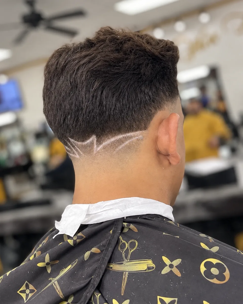 Close-up of a fresh line up with a precise hairline and tapered sides
