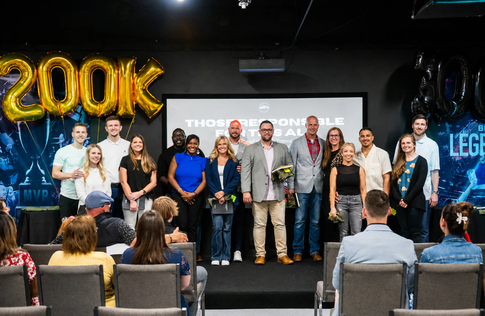 Summit community members gathered on stage to celebrate a shared milestone