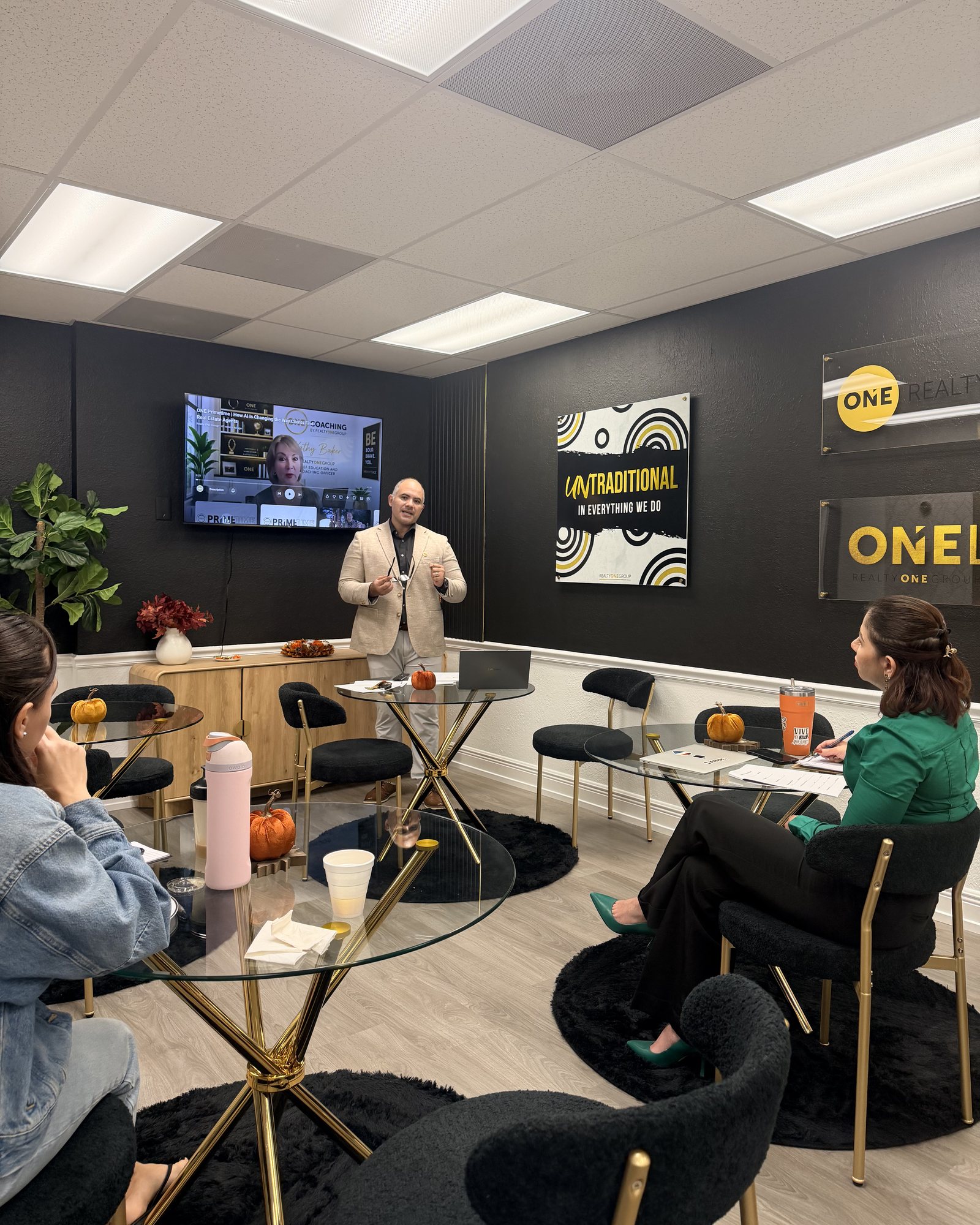 Narayan leading a training session with agents at the Realty ONE Group Precision office