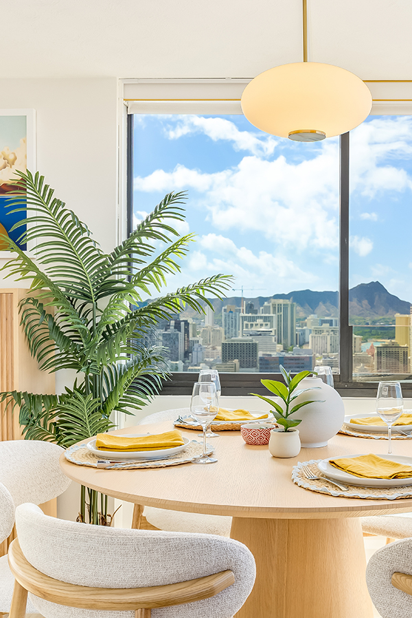woman setting sheets on bed