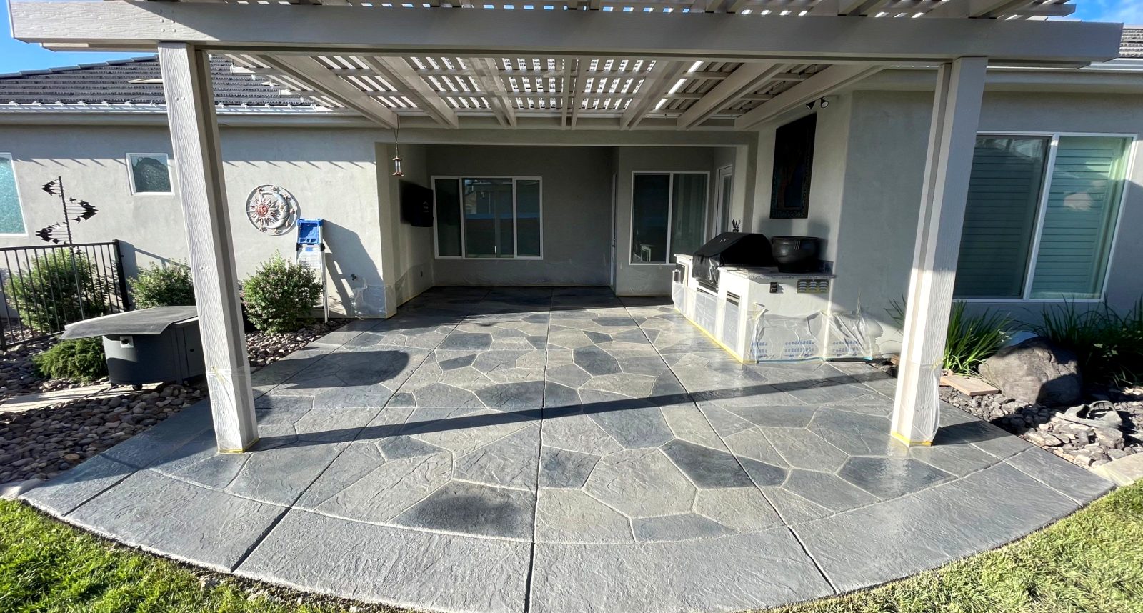 Decorative stone overlay patio by Armored Concrete Systems