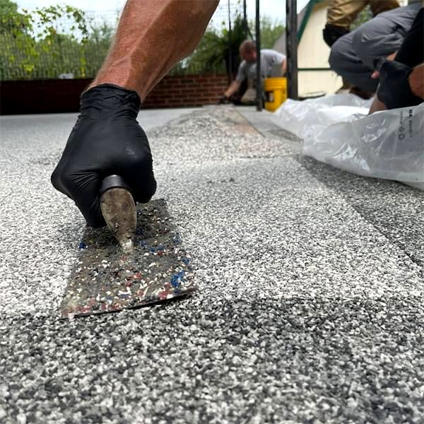 Armored Concrete Systems crew installing a flake coating