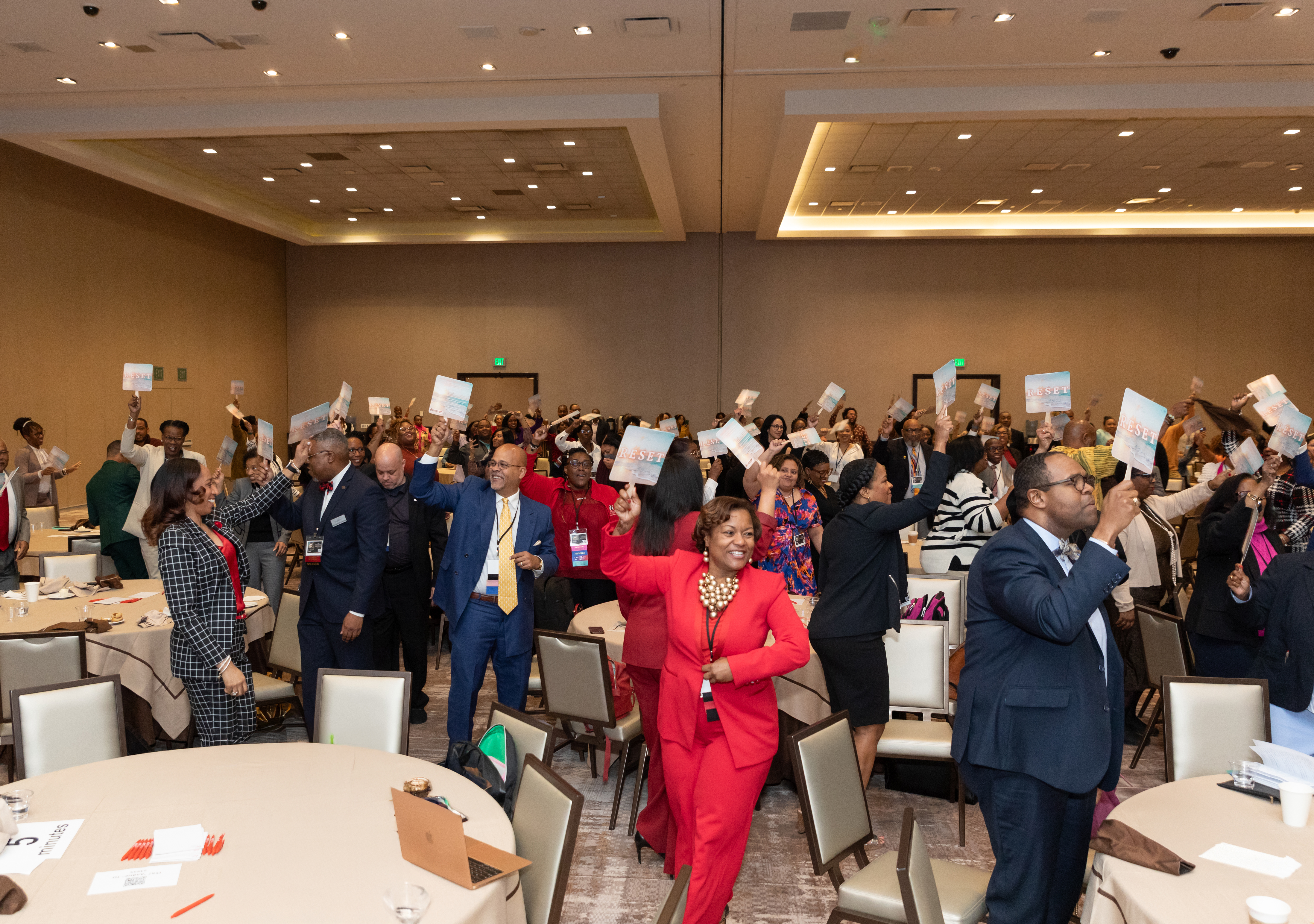 Conference attendees participating during a corporate event