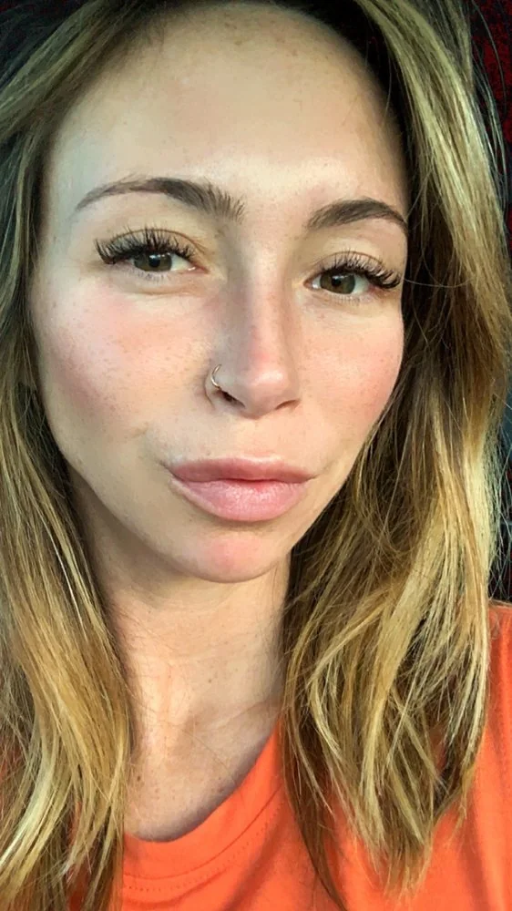 Kristyn P. wearing lash extensions and brows by Angel