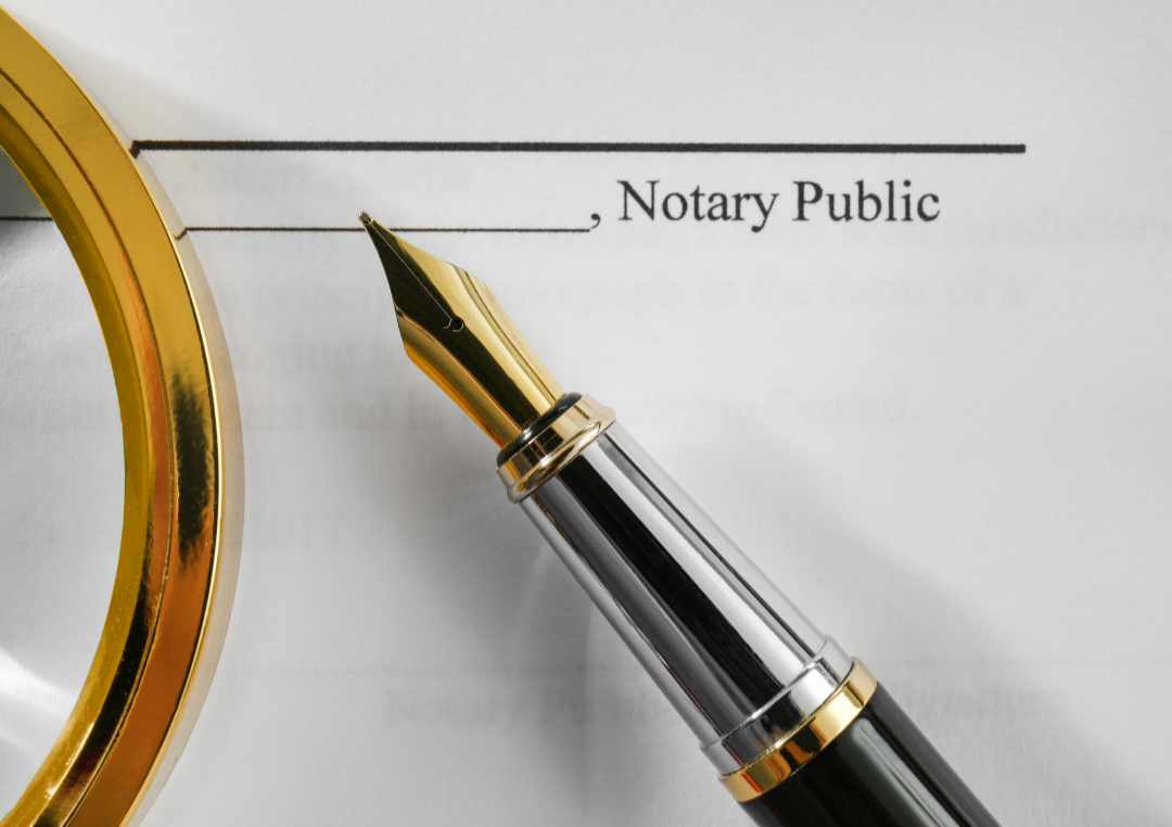 Notary public signature line on a legal document with a fountain pen ready for signing. Notary public signature line on a legal document with a fountain pen ready for signing.