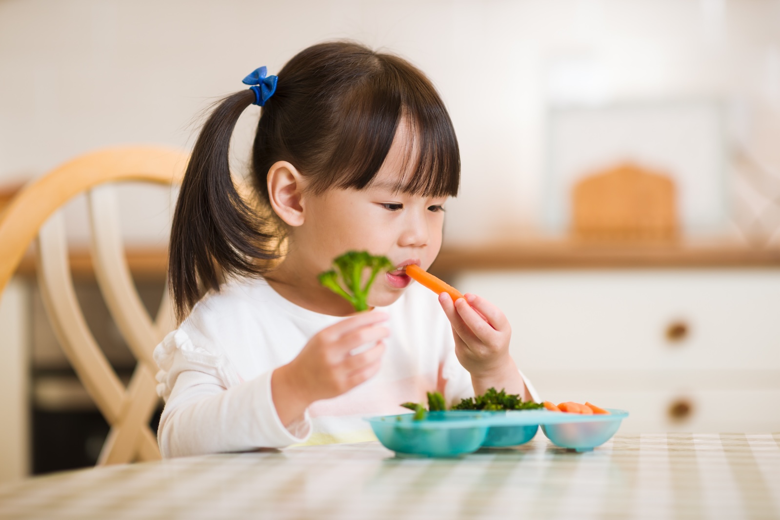 young girl trying healthy foods young girl trying healthy foods