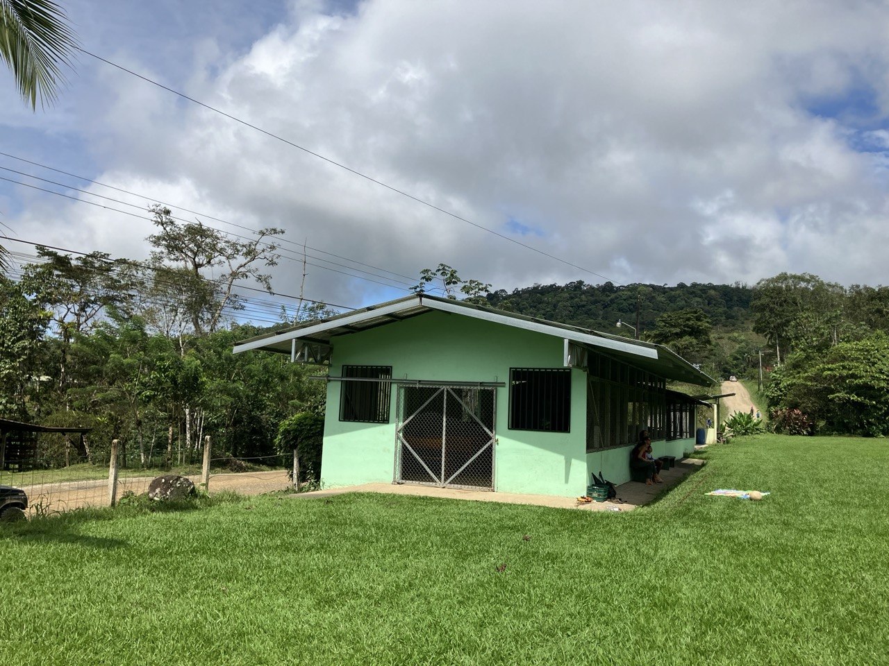 The salon with finished fence and fresh paint in 2024