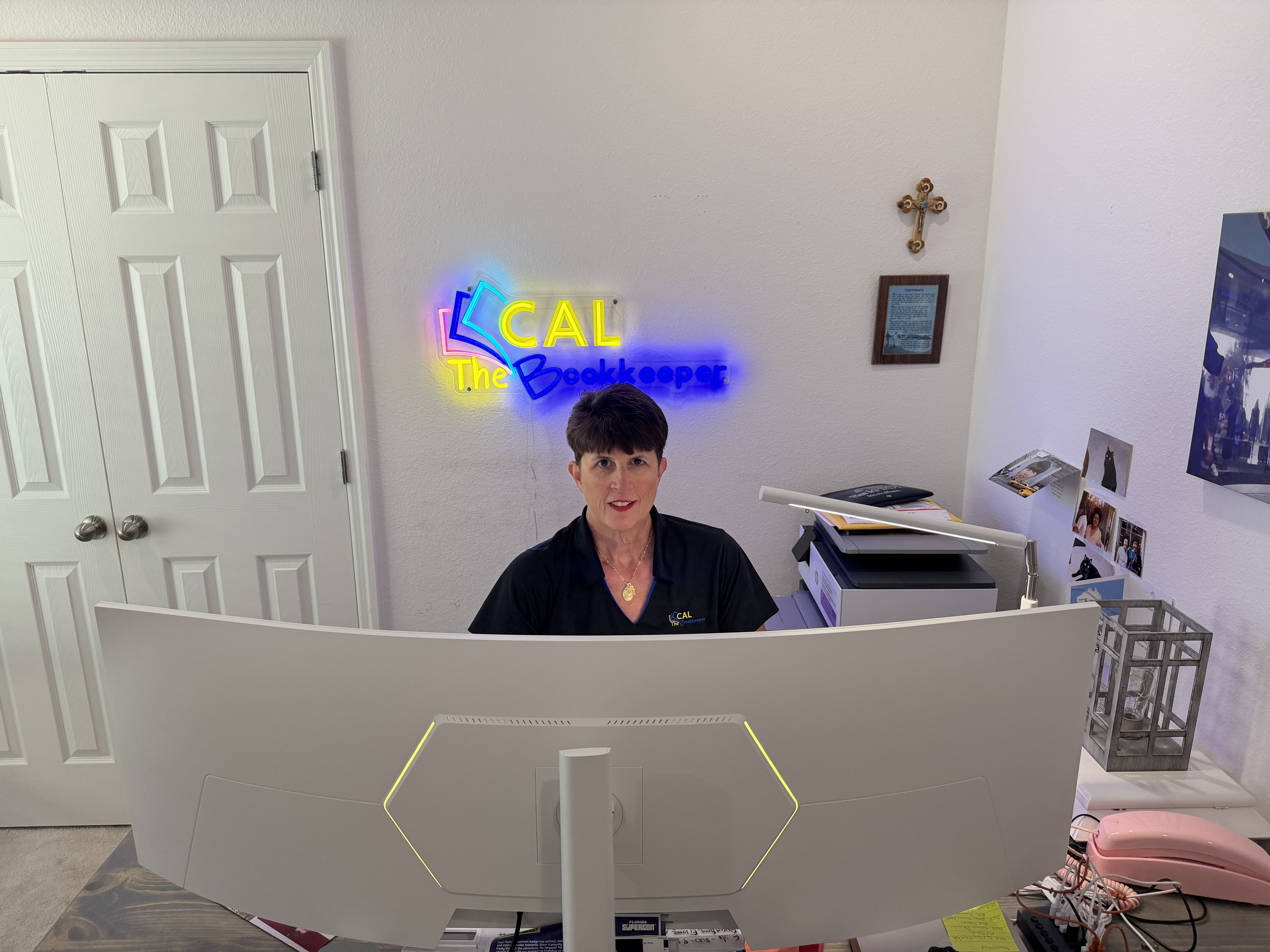A photorealistic image of a professional tax advisor and a small business owner sitting across a modern office desk, engaged in a focused discussion. The desk is neatly organized with a laptop, open financial documents, a calculator, and a cup of coffee. Both individuals are dressed in business-cual attire, with the advisor pointing to a sales tax report on the laptop screen. The setting features bright natural lighting, a bookshelf with accounting books in the background, and subtle office decor, conveying a trustworthy, collaborative atmosphere suitable for a professional blog about sales tax bookkeeping for small businesses. A photorealistic image of a professional tax advisor and a small business owner sitting across a modern office desk, engaged in a focused discussion. The desk is neatly organized with a laptop, open financial documents, a calculator, and a cup of coffee. Both individuals are dressed in business-cual attire, with the advisor pointing to a sales tax report on the laptop screen. The setting features bright natural lighting, a bookshelf with accounting books in the background, and subtle office decor, conveying a trustworthy, collaborative atmosphere suitable for a professional blog about sales tax bookkeeping for small businesses.