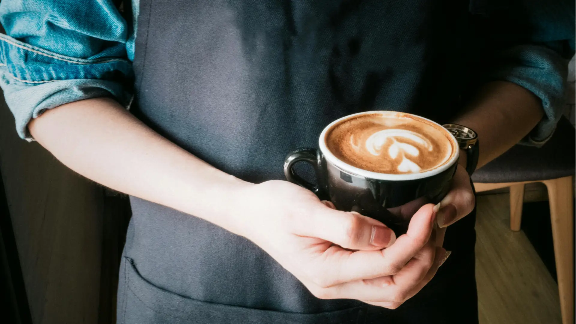 Barista finishing an espresso in a Mrs. Rose cup