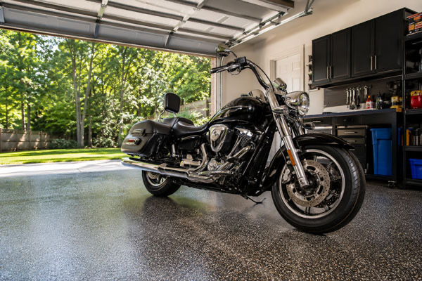Motorcycle being detailed inside a Great Falls VA garage by mobile service
