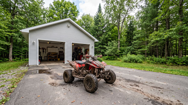 Muddy ATV ready for mobile detailing at a Manassas VA home