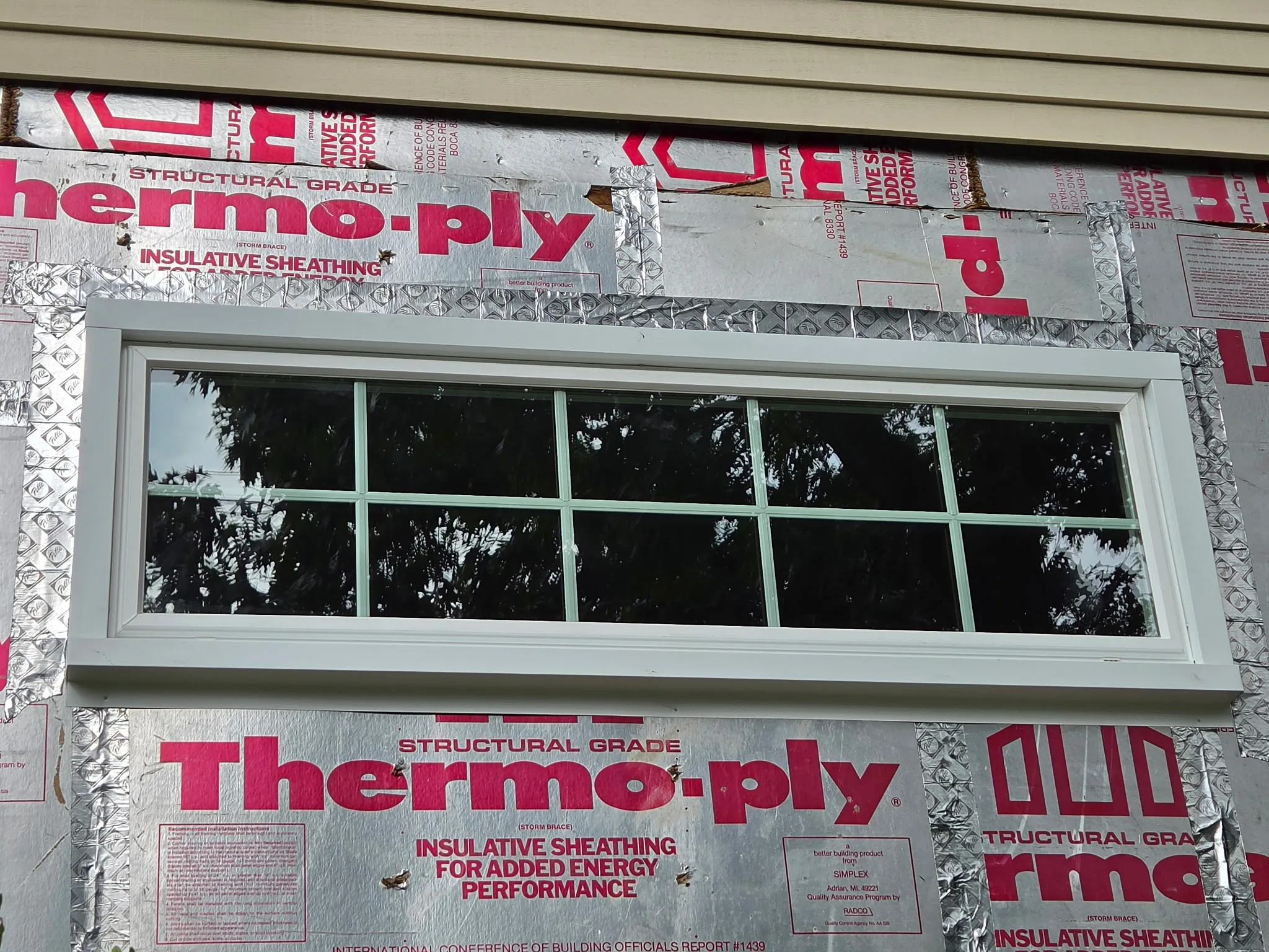 Replacement windows and entry door on a remodeled Maryland home