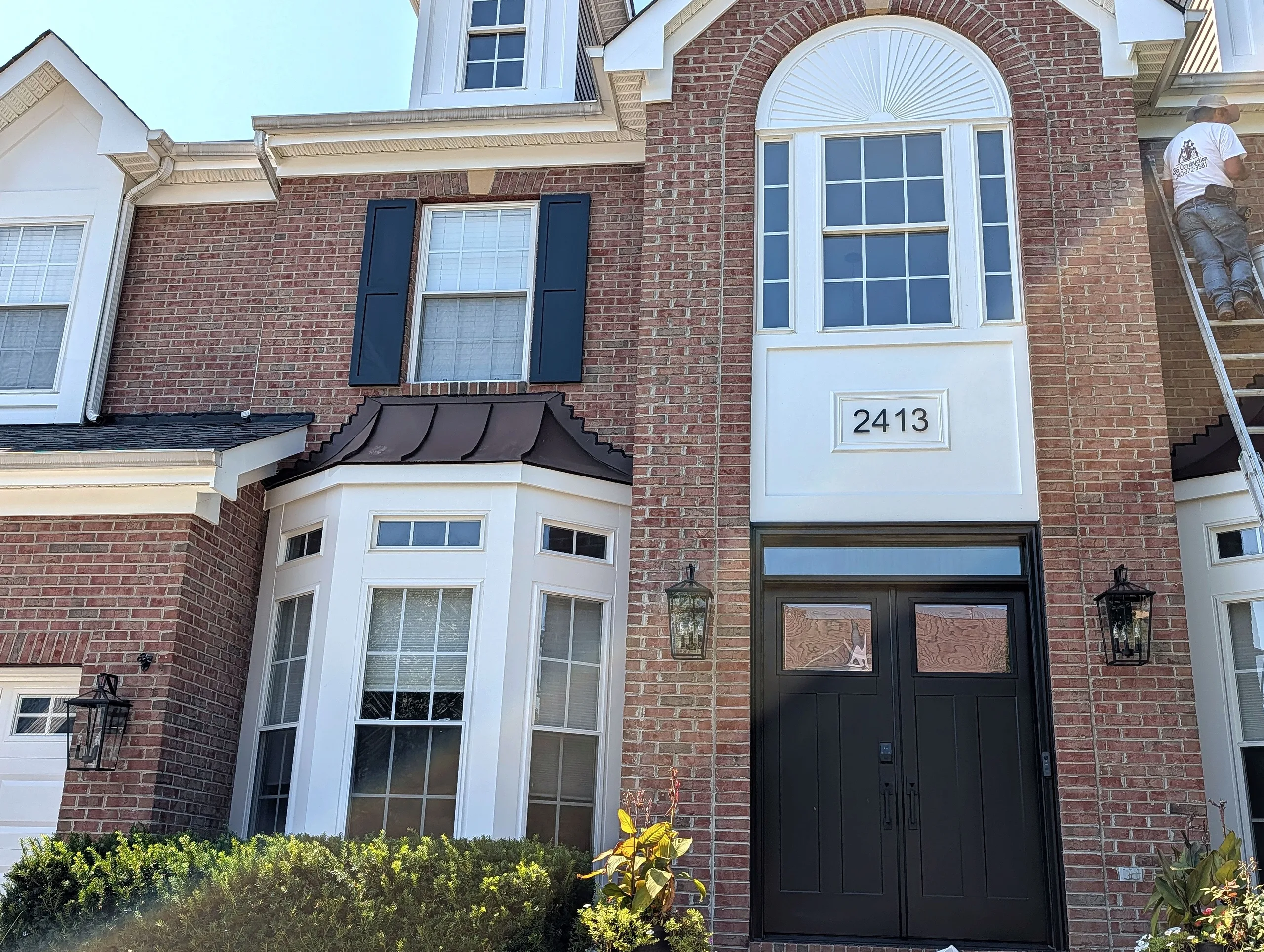 Finished window installation with fresh exterior capping and trim