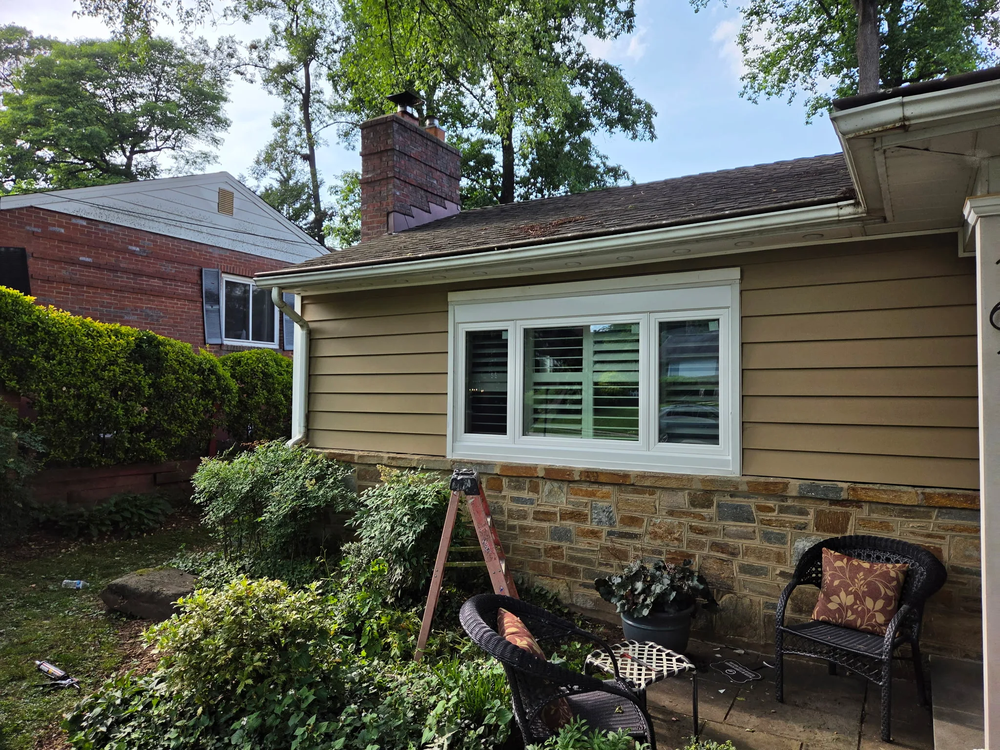Bow window installation adding space and light to a living room