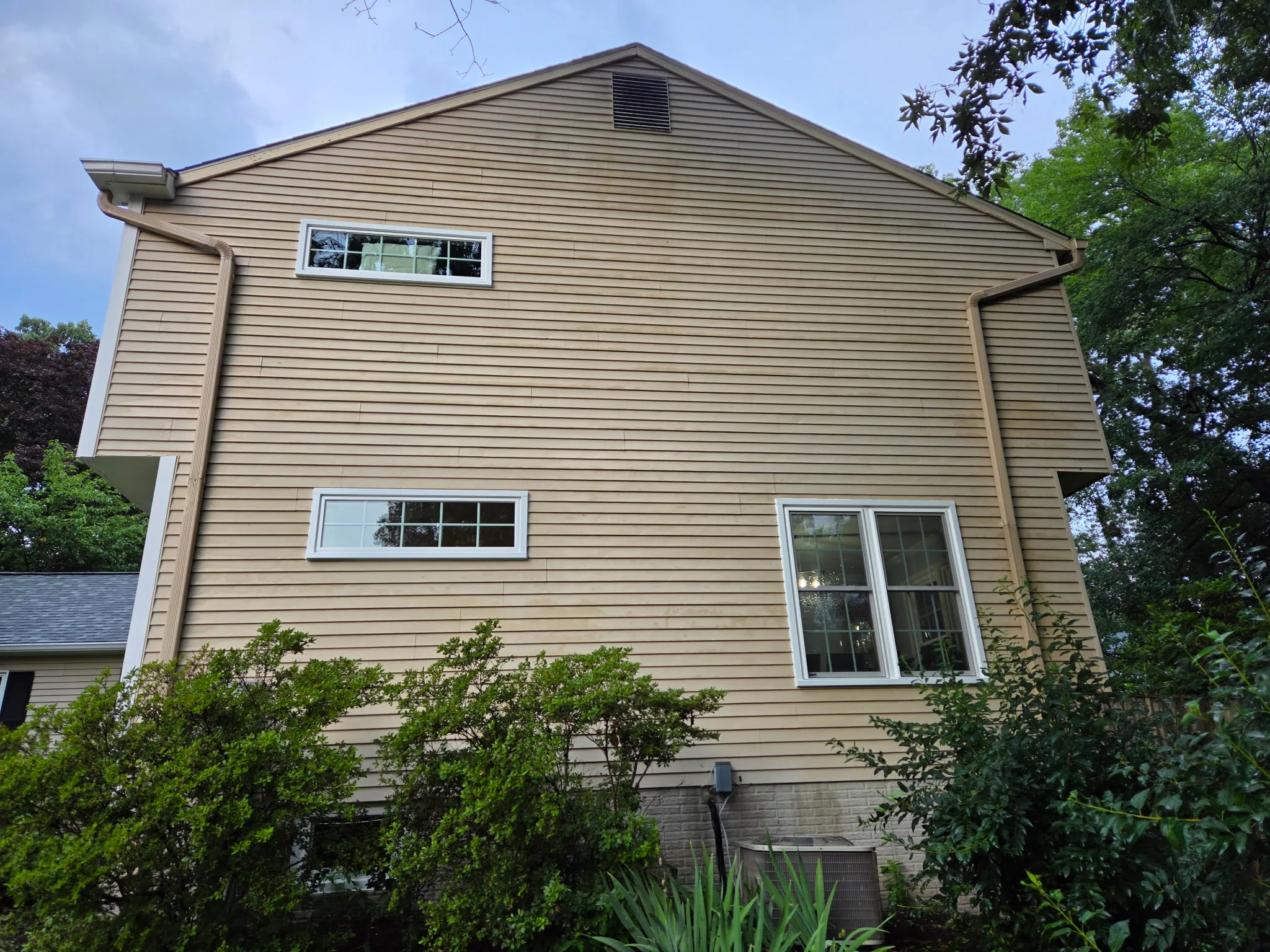 Finished exterior remodel with new windows, door, and siding