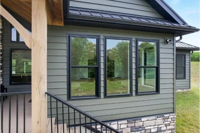 Vinyl replacement double-hung window on a suburban home