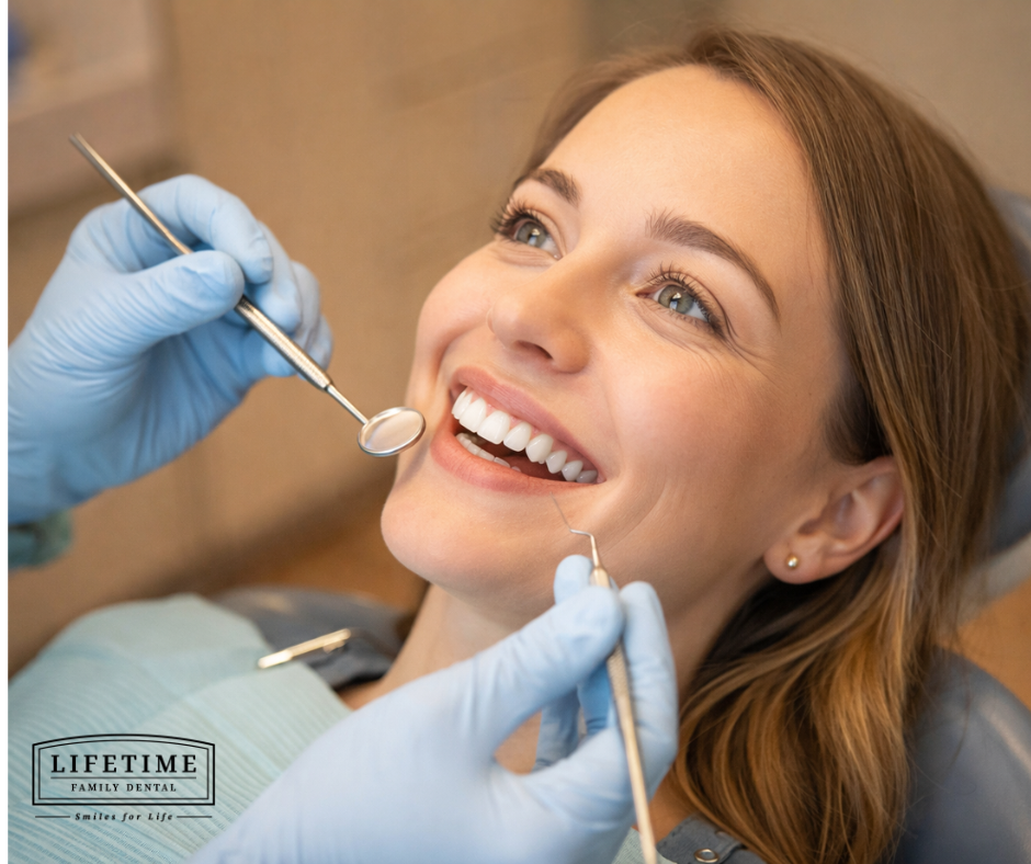 Close-up of a smiling person at a dental exam, warm and reassuring — not clinical or alarming. Clean, hopeful tone.