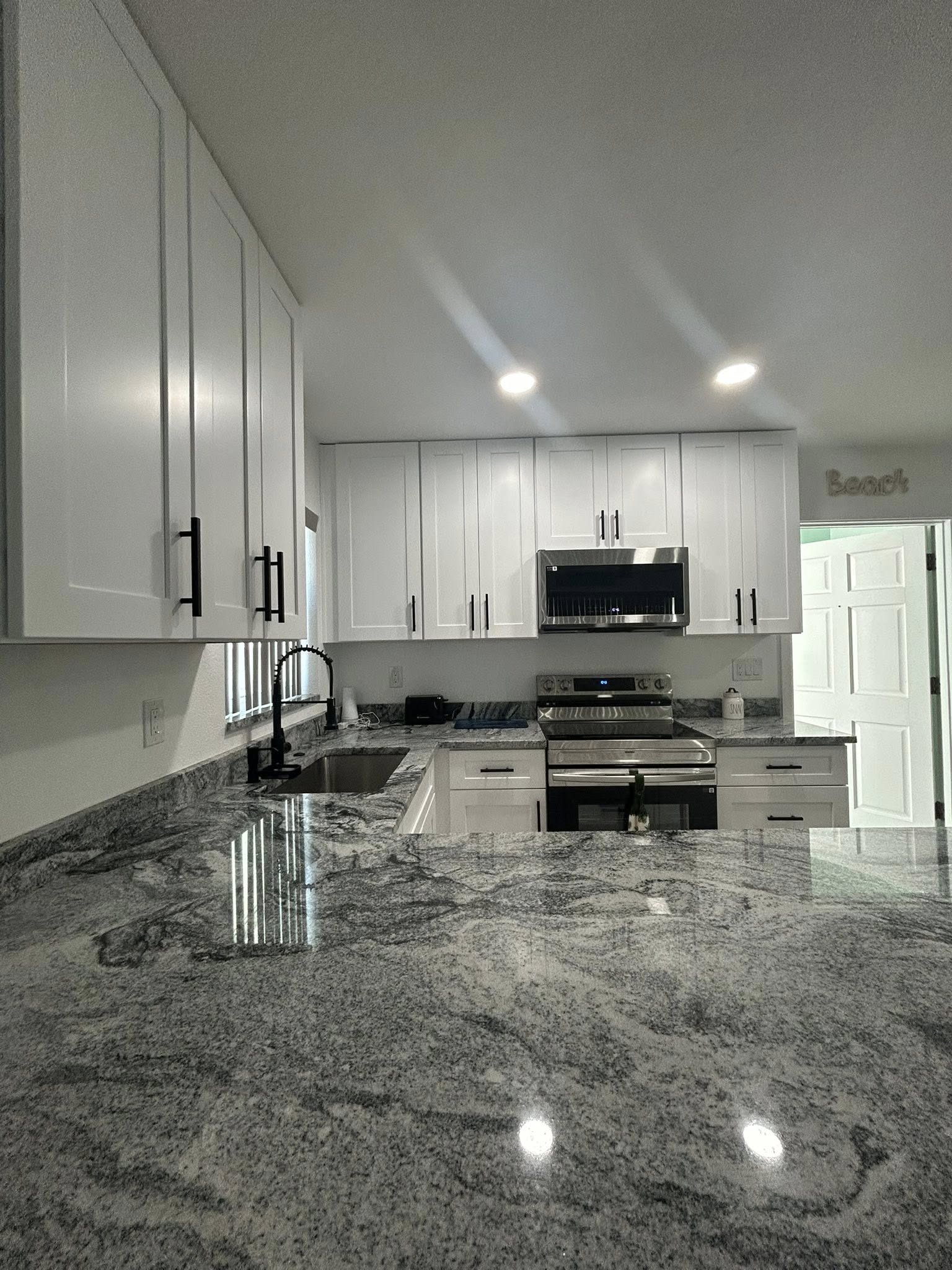 Kitchen cabinets counters and lighting remodel