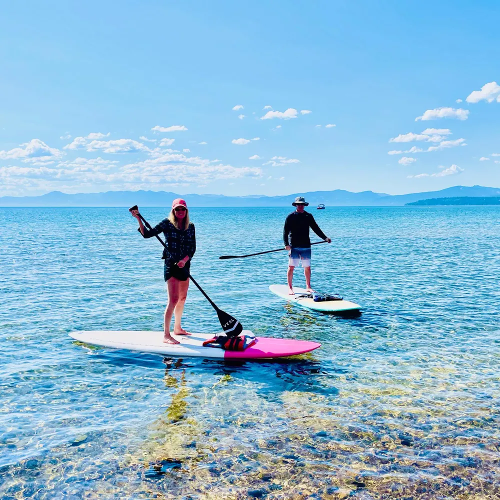 Paddleboarding on a clear mountain lake