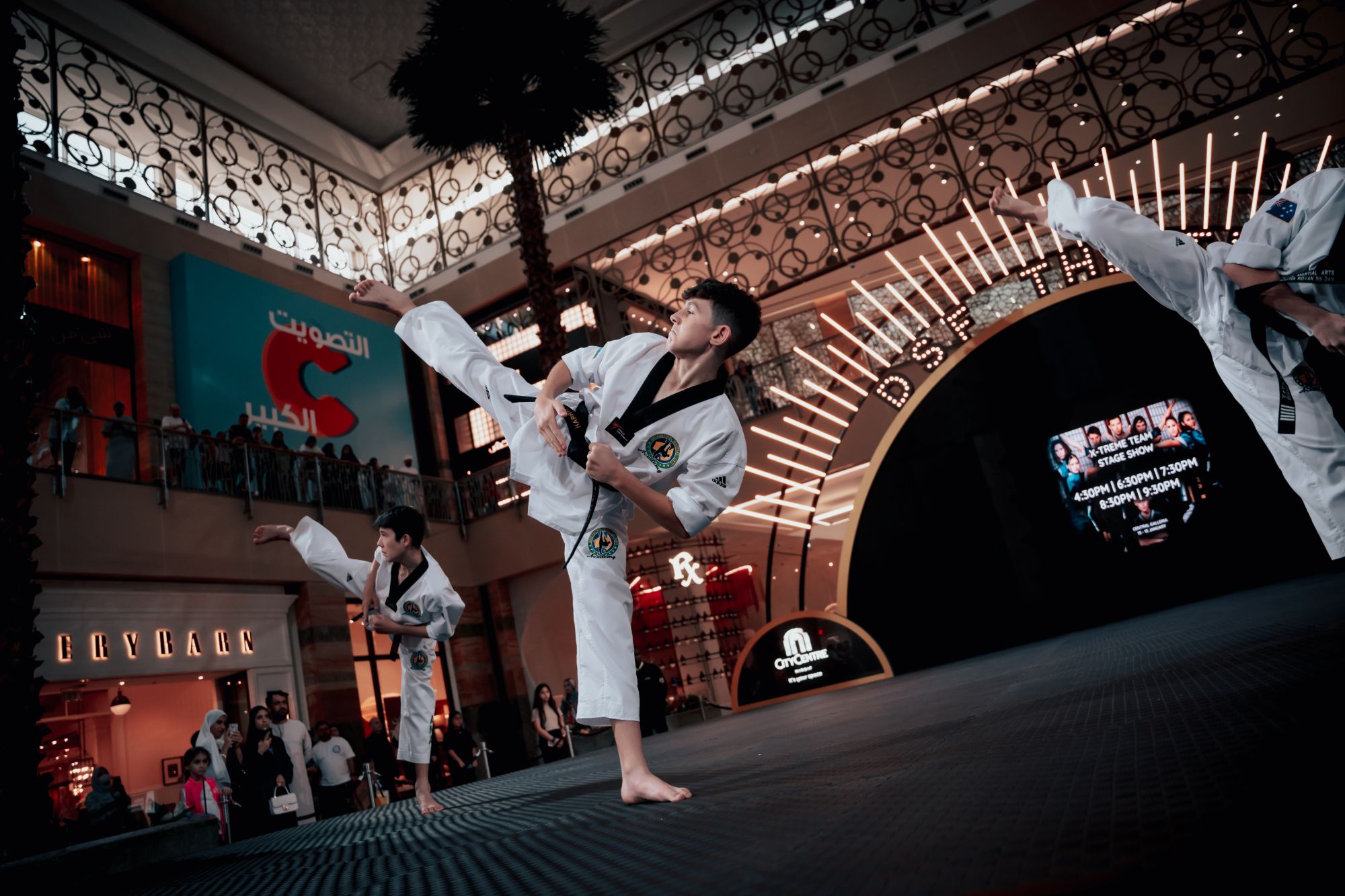 Xtreme Team performing high kicks at the Dubai Shopping Festival