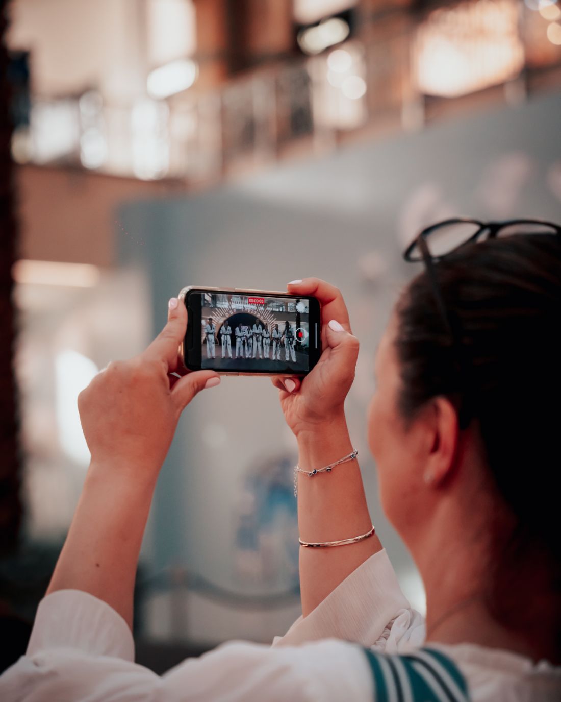 Audience filming the show