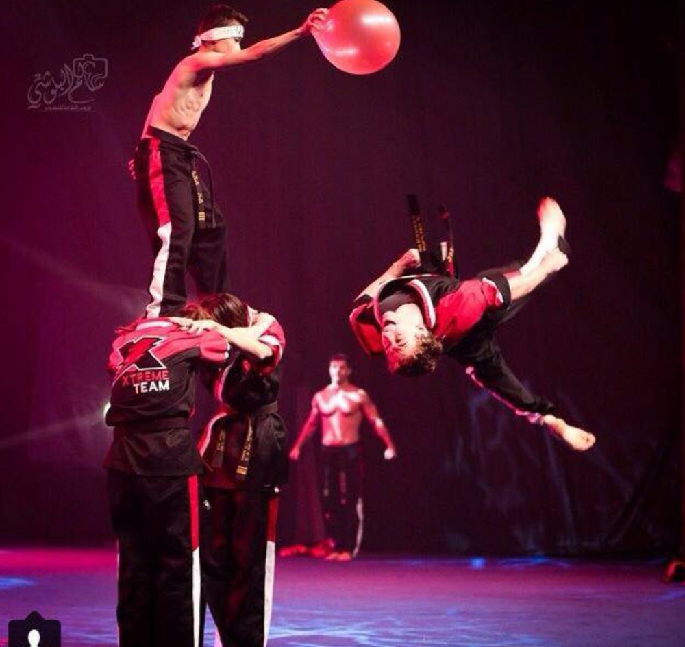 Xtreme Team stage stunt with flip and balloon