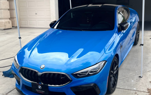 bright blue bmw m8 after a paint correction and ceramic coating