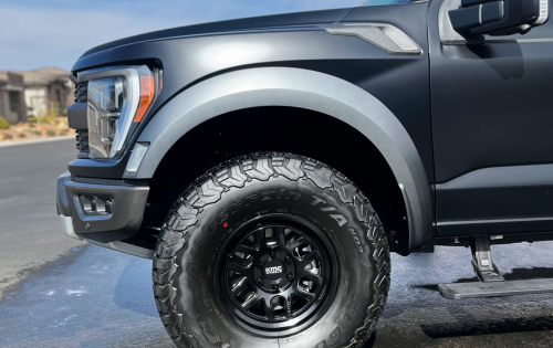 side angle of a matte black ford f150 raptor after a exterior detail from zaro detailing
