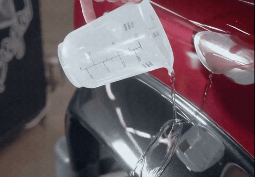 demonstration of water beading off paint after a ceramic coating