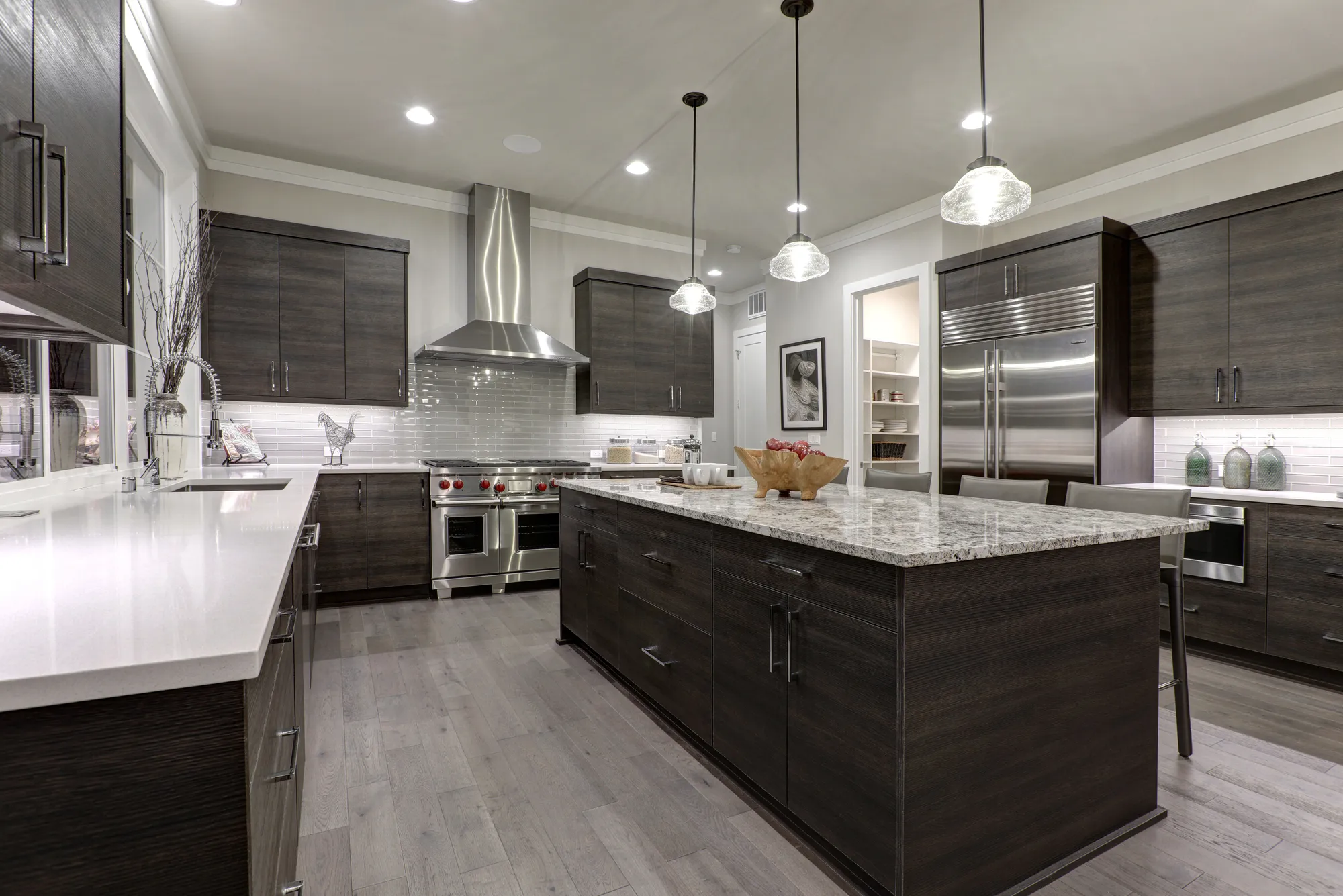 Completed modern kitchen remodel with dark cabinetry