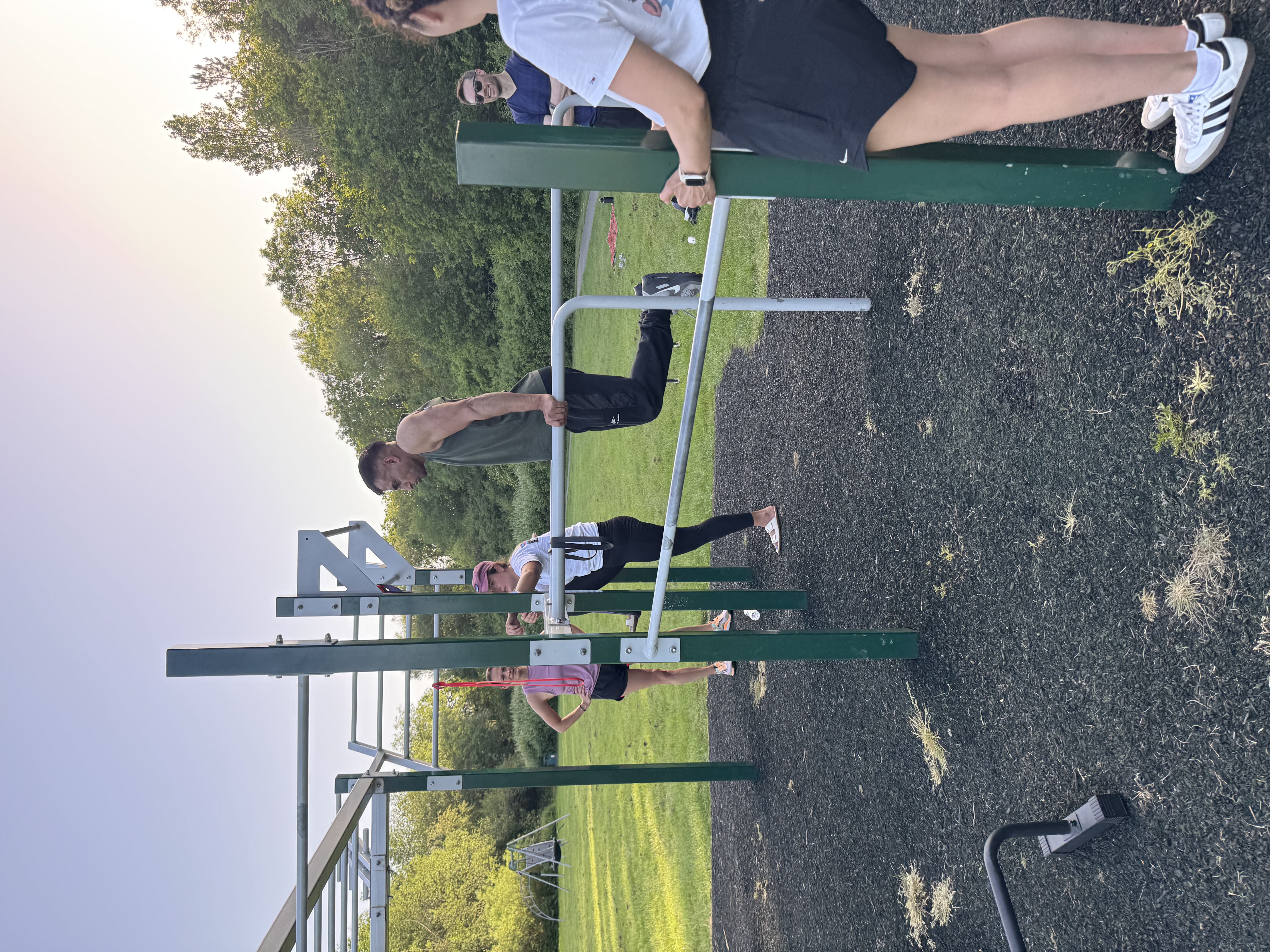 Leamington Calisthenics members training on outdoor parallel bars