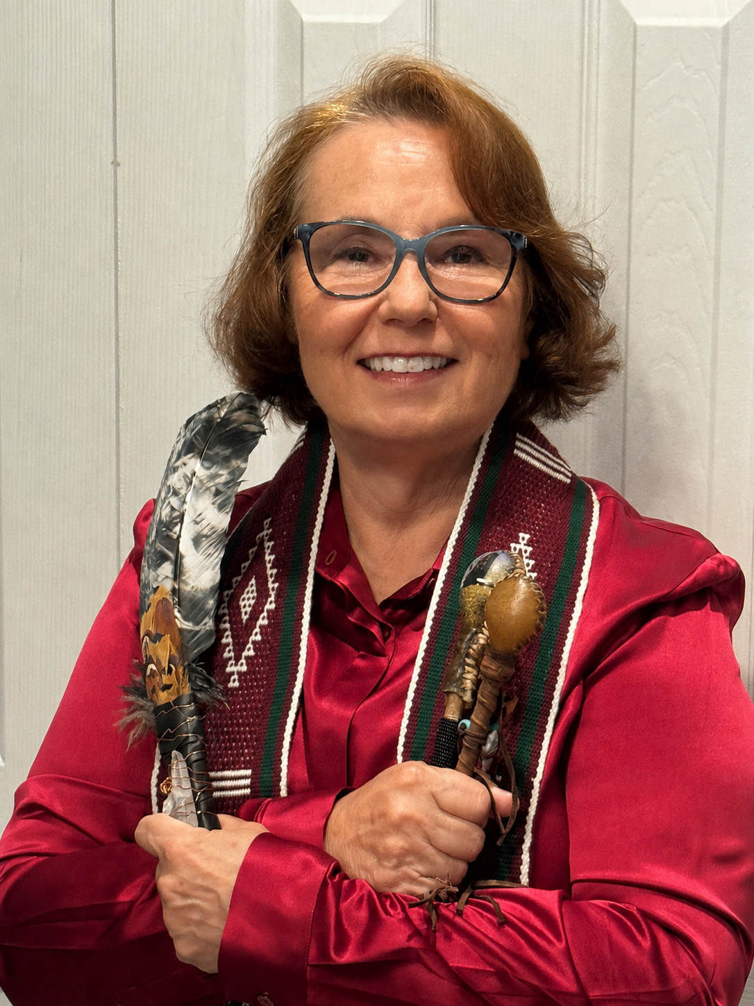 Dr. Lisa Nezneski holding sacred shamanic tools