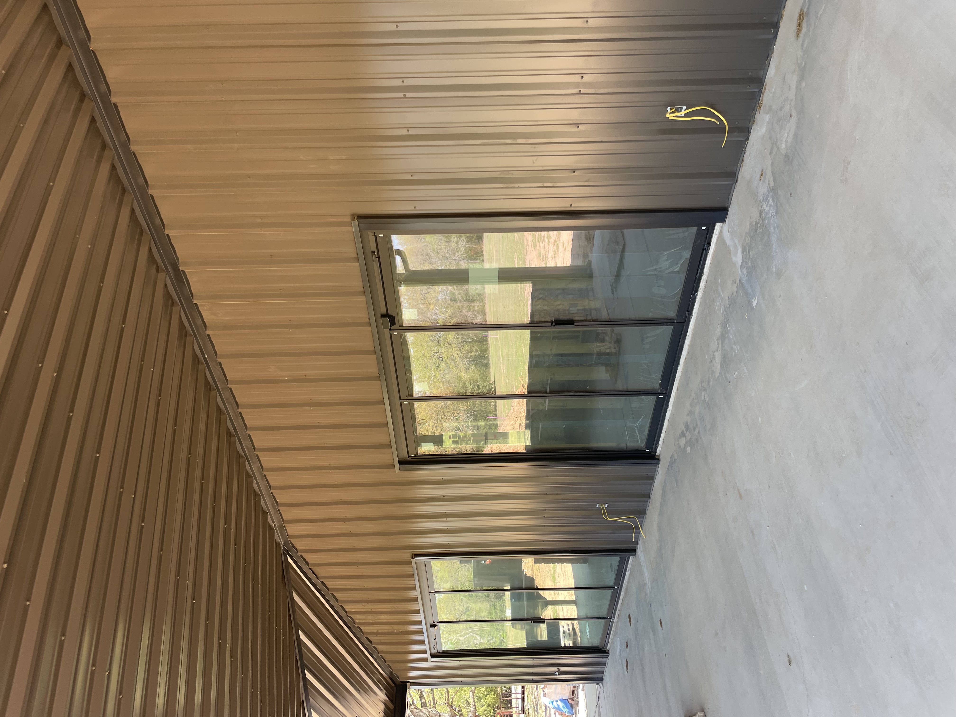 Sliding doors on a barndominium patio