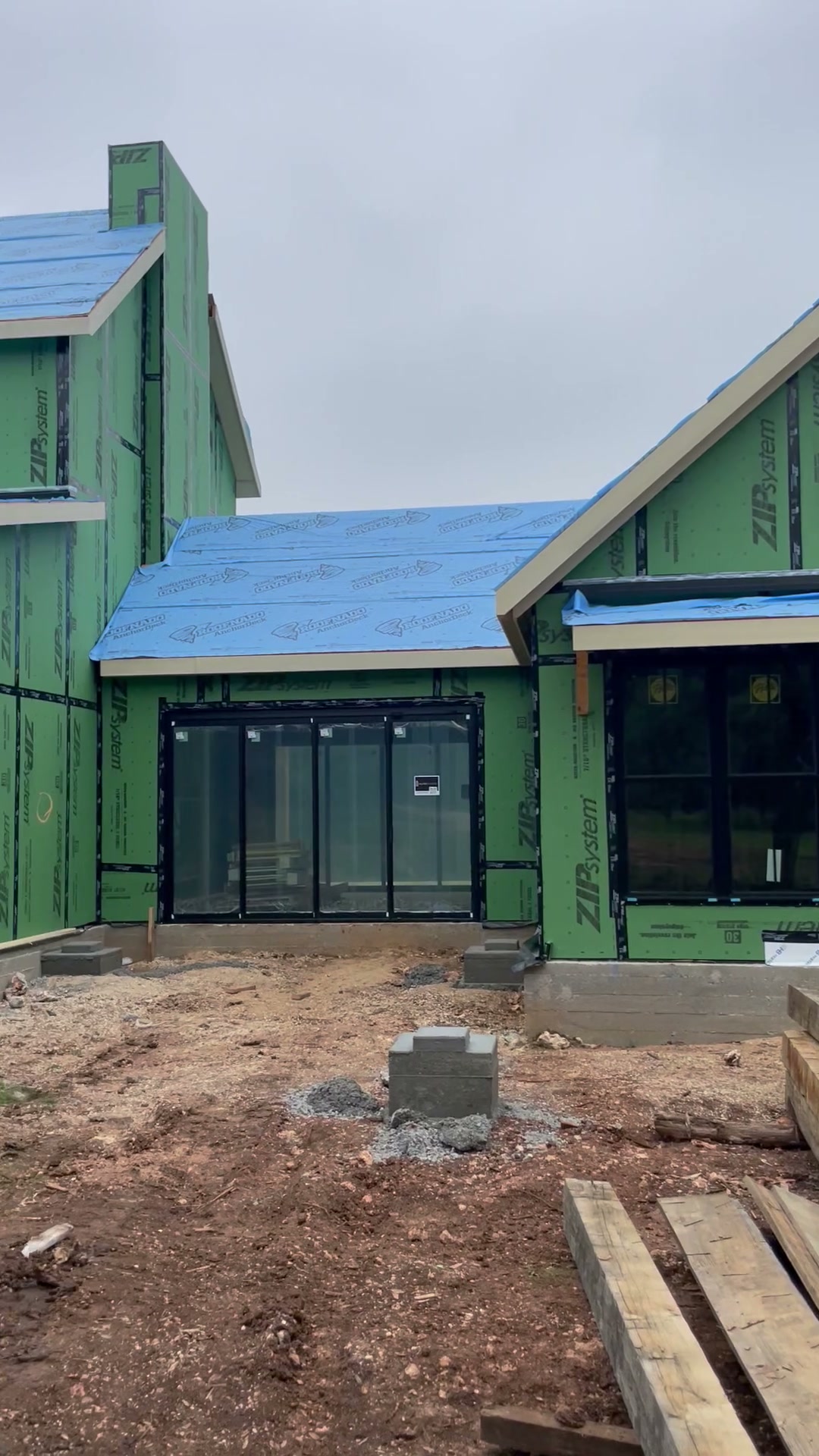 New custom home exterior under construction