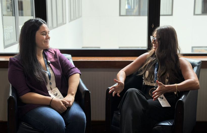 Two advisors in conversation.