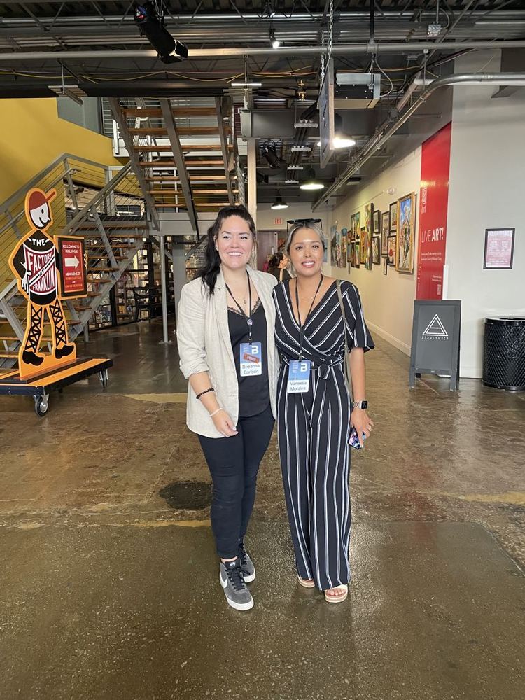 Advisor Elevated team members at an event