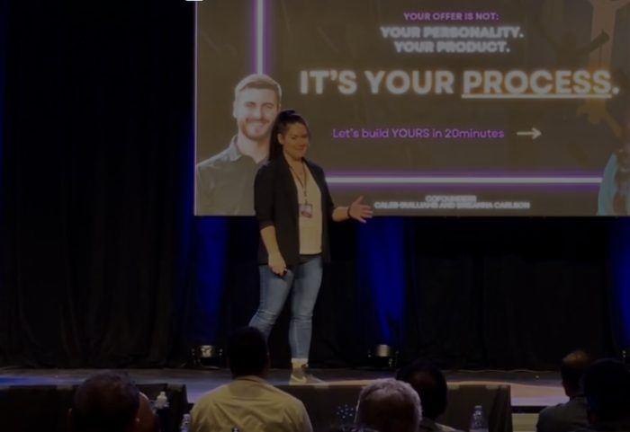 Brieanna Carlson speaking on stage