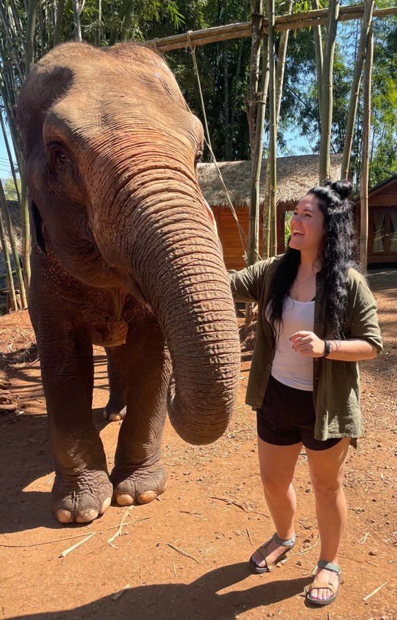 Brieanna Carlson with an elephant in Thailand
