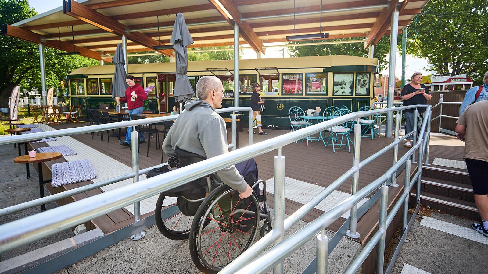 Wheelchair user encountering an accessibility issue at a public business