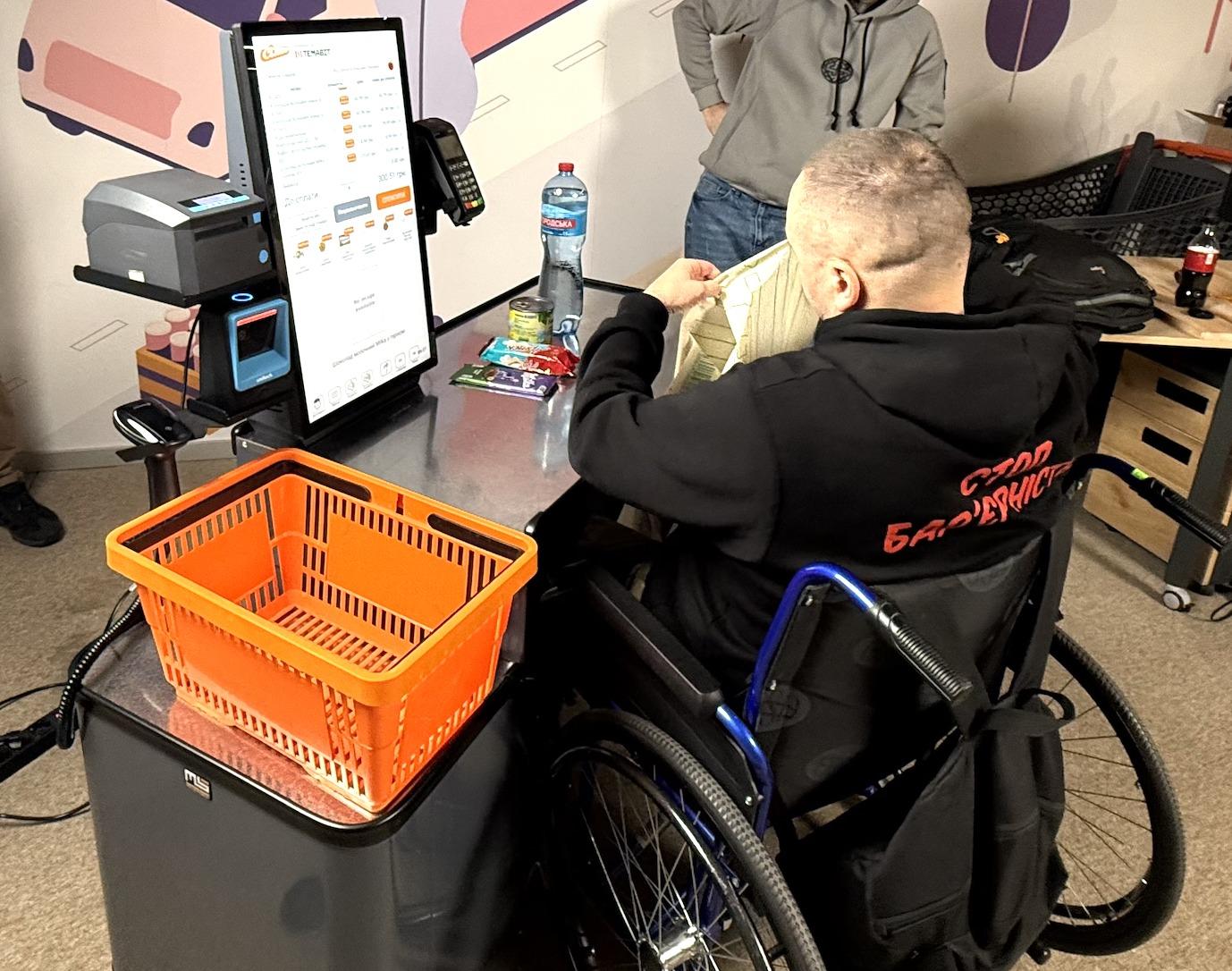 Wheelchair user using a sales or service counter