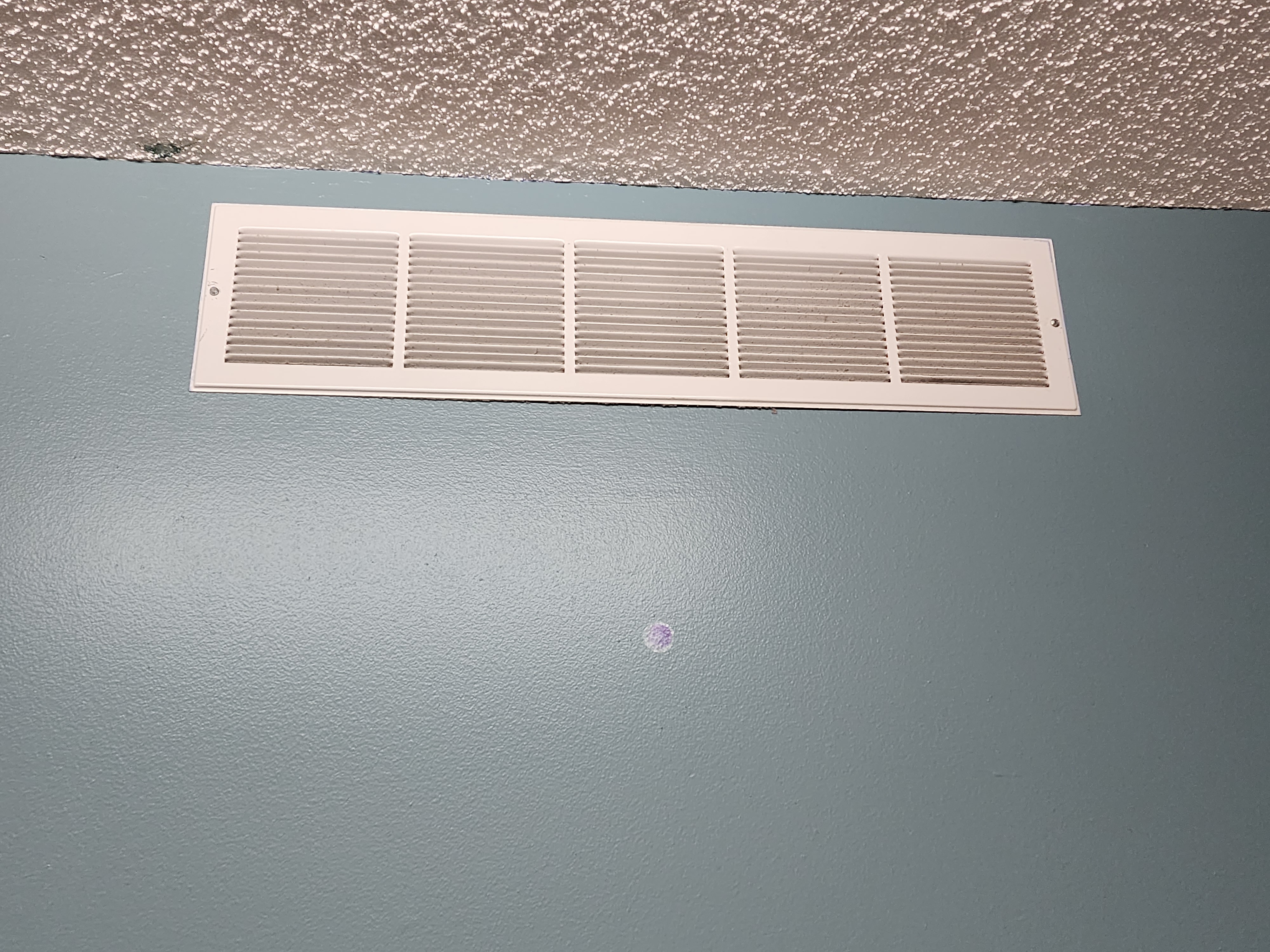 Air vent before cleaning - thick dust buildup