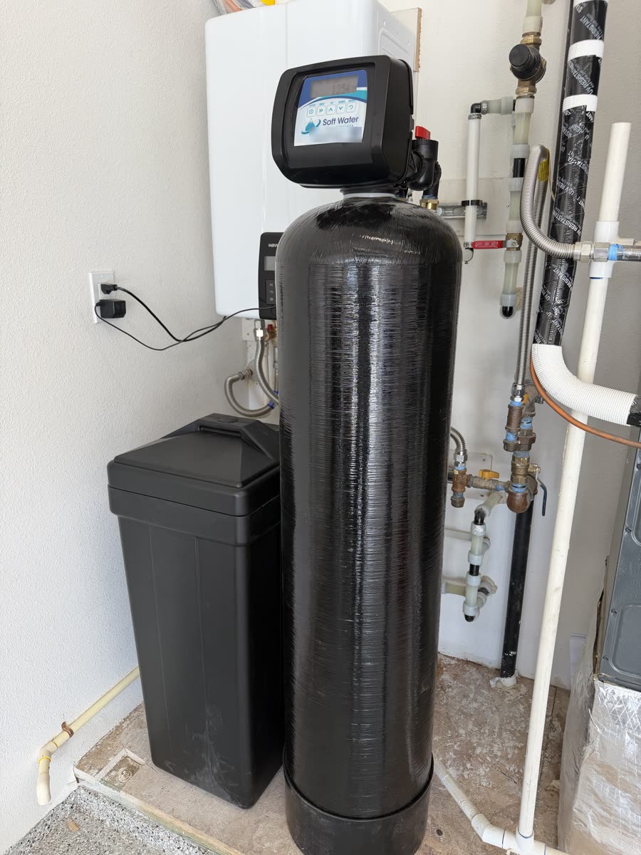 A finished water softener install in a Treasure Valley garage, with the softener tank and brine tank side by side