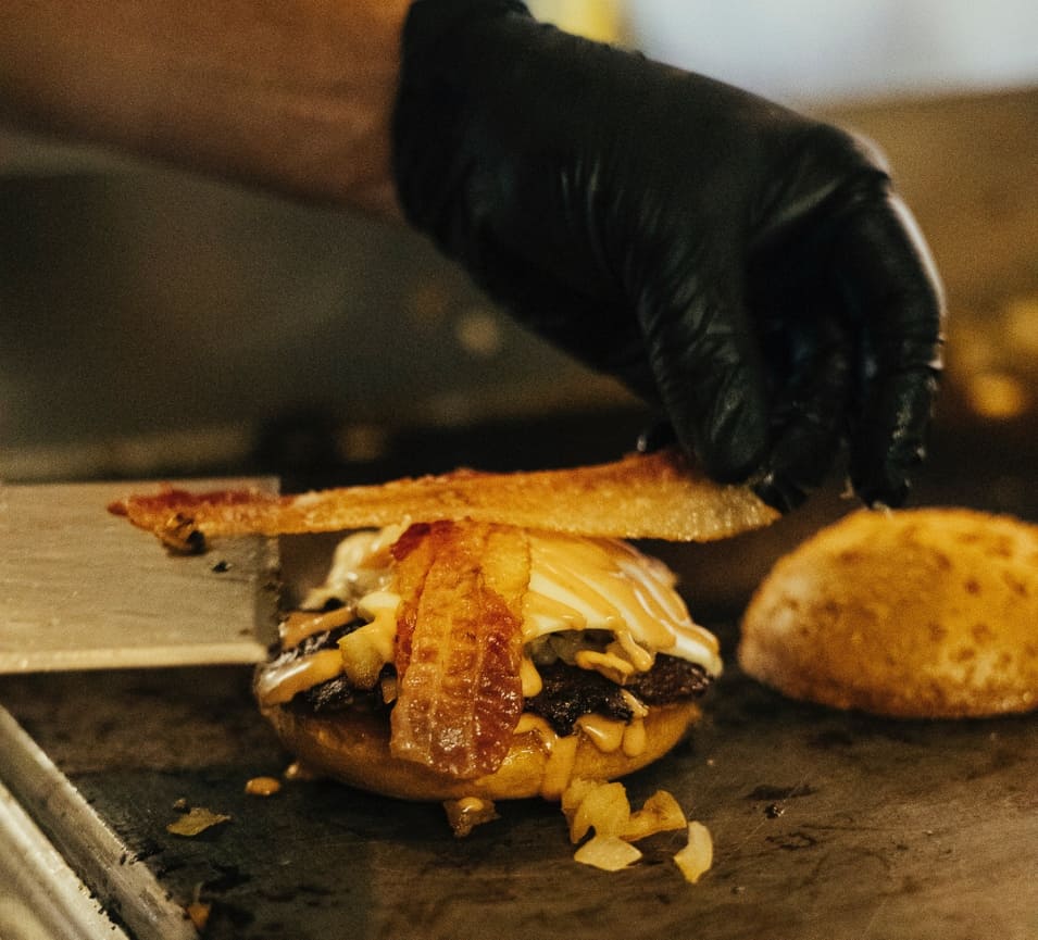 Panda Sal's smash burger with melted cheese and fresh toppings