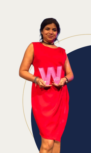 Padmasini Dayananda holding award