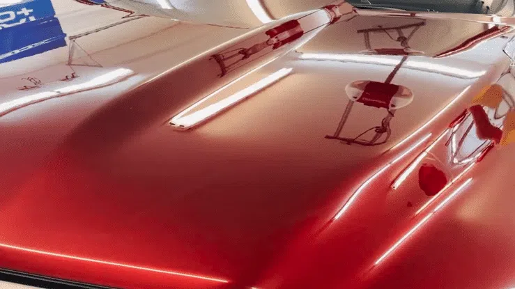 Water beading and rolling off the ceramic coated hood of a truck