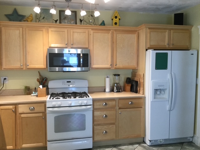 Before kitchen with natural wood cabinets