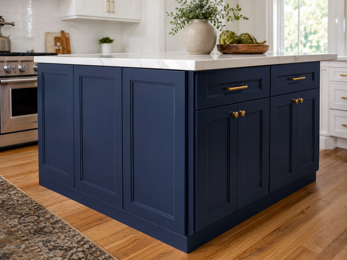 Finished kitchen with white cabinets and blue island
