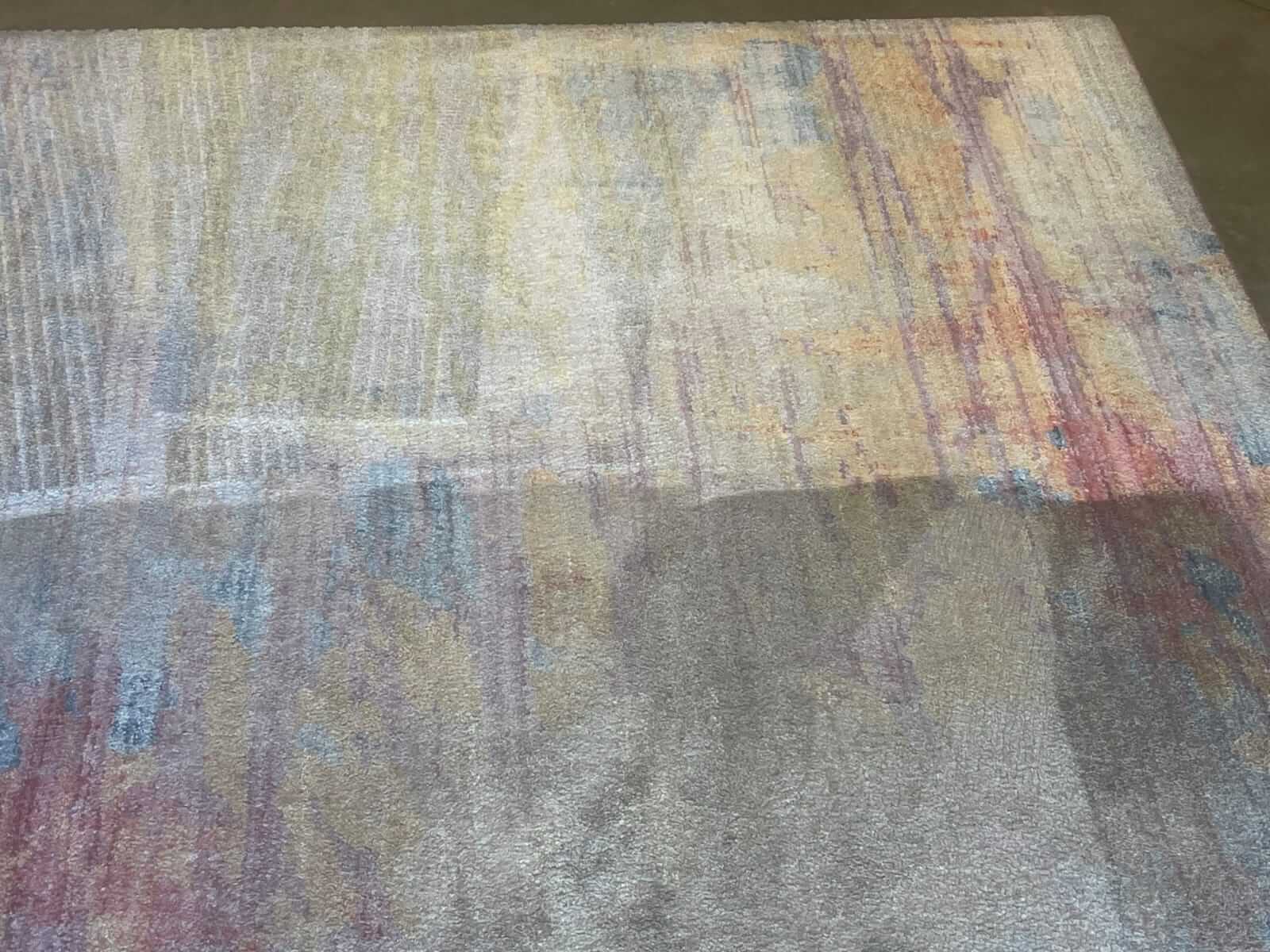 An area rug being cleaned properly