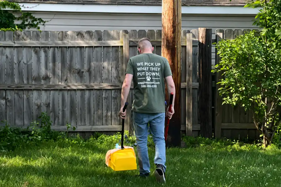 Greg providing Waggin Waste yard cleanup service